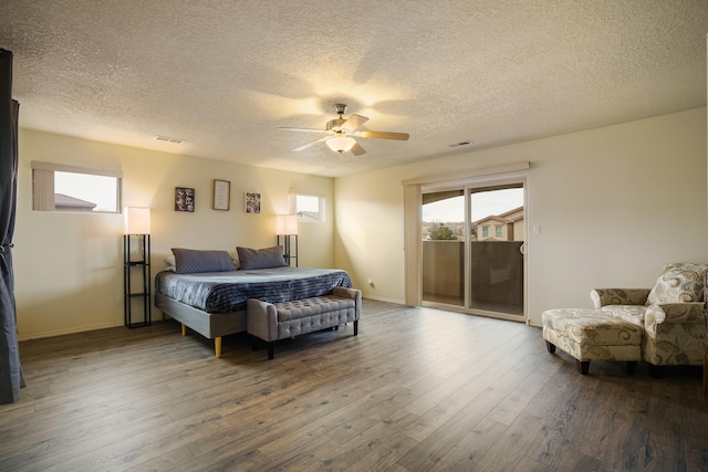 bedroom with a textured ceiling, access to outside, ceiling fan, and hardwood / wood-style flooring