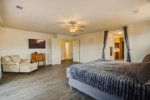 bedroom featuring ceiling fan and dark hardwood / wood-style floors