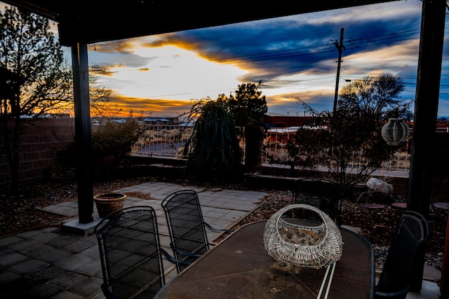 view of patio terrace at dusk