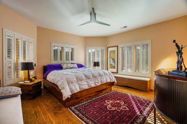 bedroom featuring hardwood / wood-style floors and ceiling fan