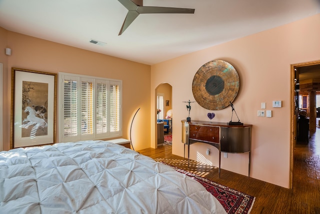 bedroom with ceiling fan and hardwood / wood-style flooring