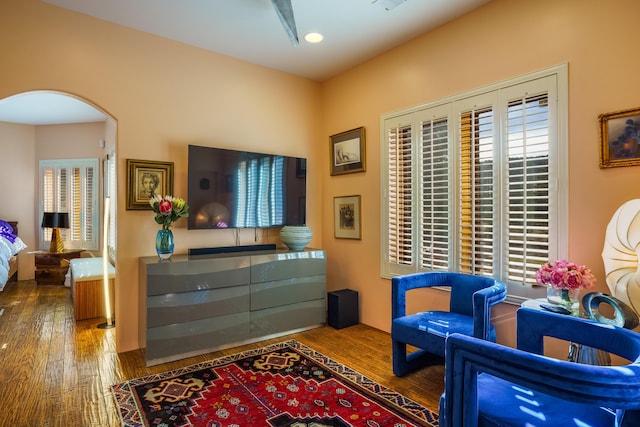 sitting room featuring hardwood / wood-style floors and a healthy amount of sunlight