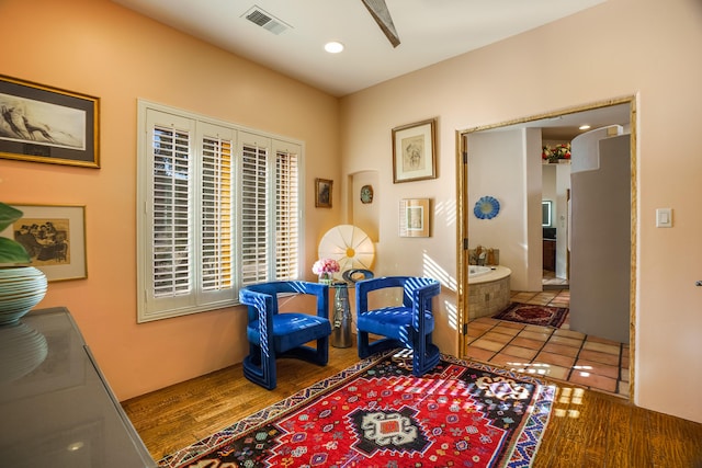 sitting room featuring hardwood / wood-style floors