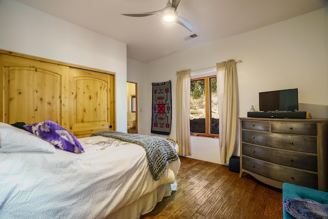 bedroom with ceiling fan and dark hardwood / wood-style flooring