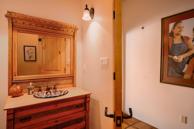 bathroom with vanity and tile patterned floors