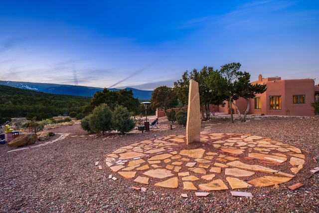 patio terrace at dusk with a mountain view