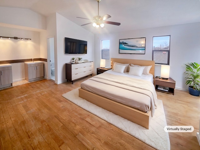 bedroom featuring vaulted ceiling, ceiling fan, and light hardwood / wood-style floors