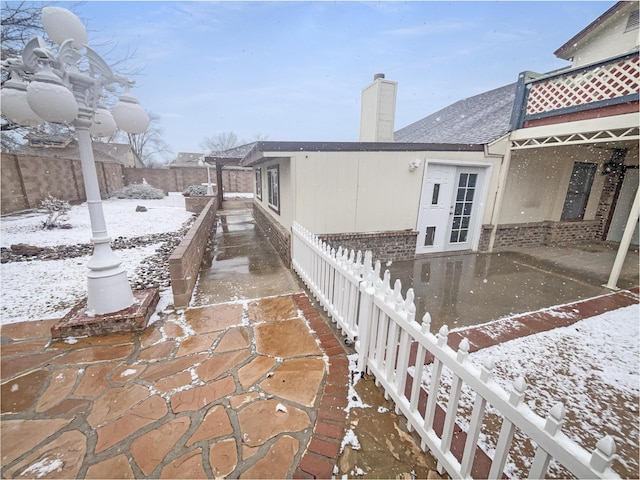 view of snow covered patio