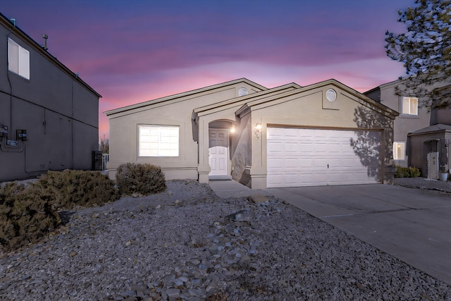 ranch-style house featuring a garage