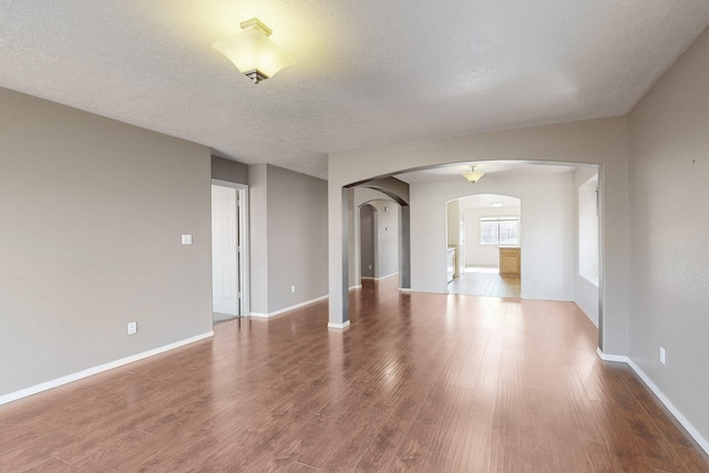 empty room featuring hardwood / wood-style floors and a textured ceiling