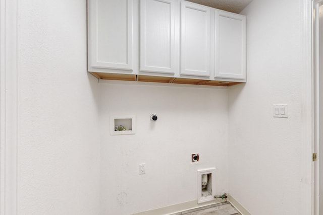 laundry area with washer hookup, electric dryer hookup, cabinets, and hookup for a gas dryer