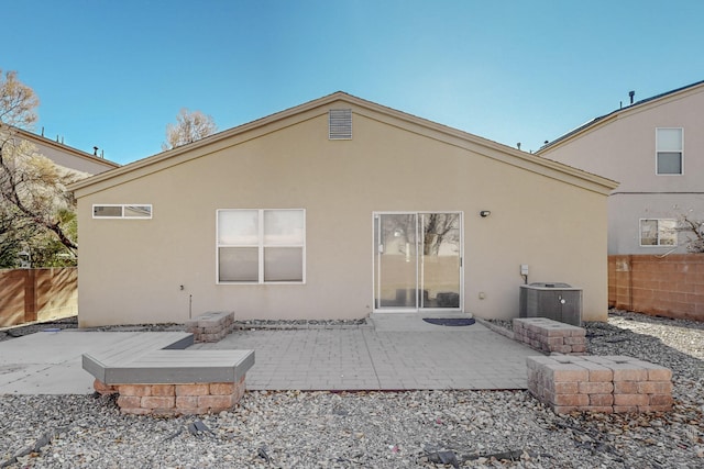 back of house with a patio and cooling unit