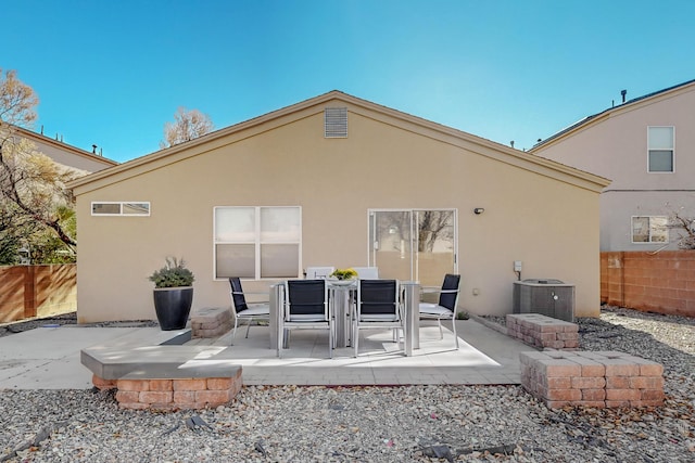 rear view of property with a patio and central AC unit