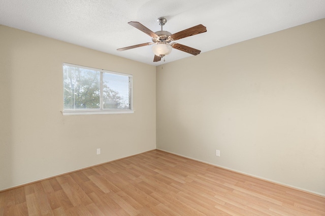 unfurnished room featuring a textured ceiling, ceiling fan, and light hardwood / wood-style flooring