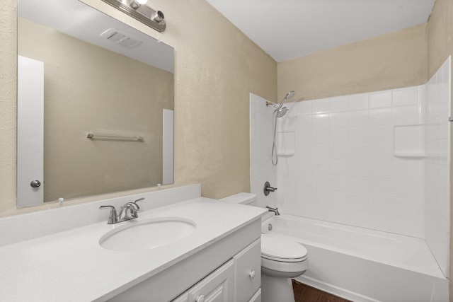 full bathroom with toilet, tub / shower combination, hardwood / wood-style floors, and vanity