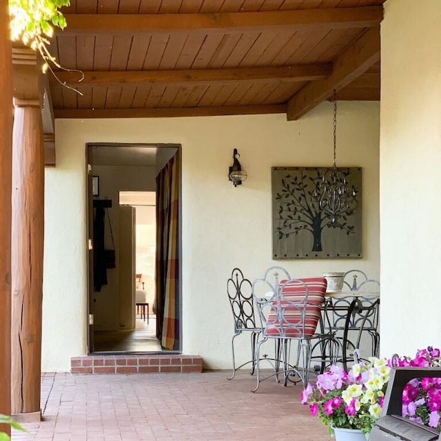 doorway to property featuring stucco siding
