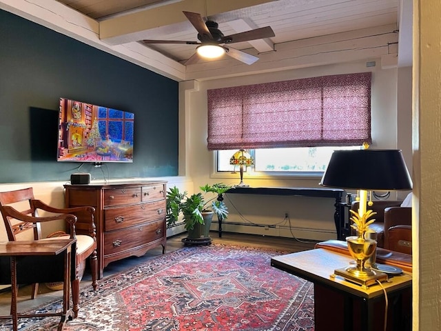 living area with a baseboard radiator, wood finished floors, and ceiling fan