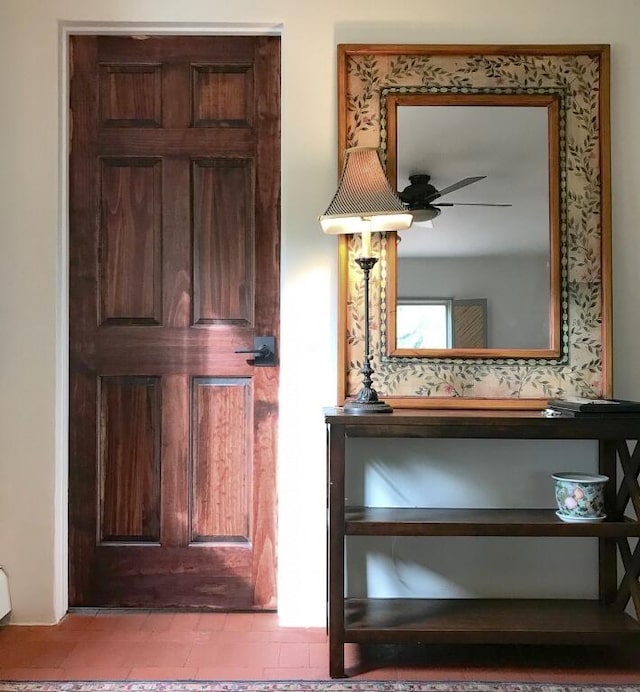 entrance foyer with a ceiling fan
