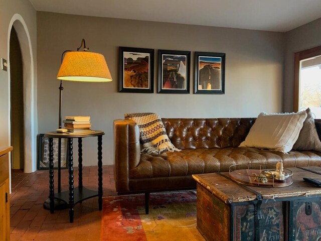 living room featuring arched walkways