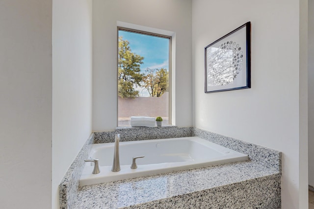 bathroom with a garden tub