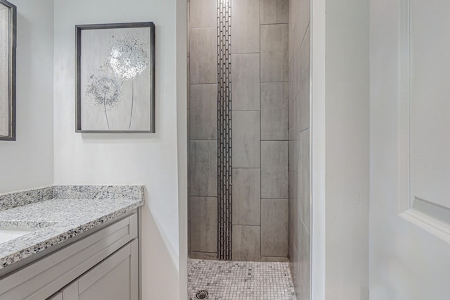 full bath featuring vanity and a shower stall