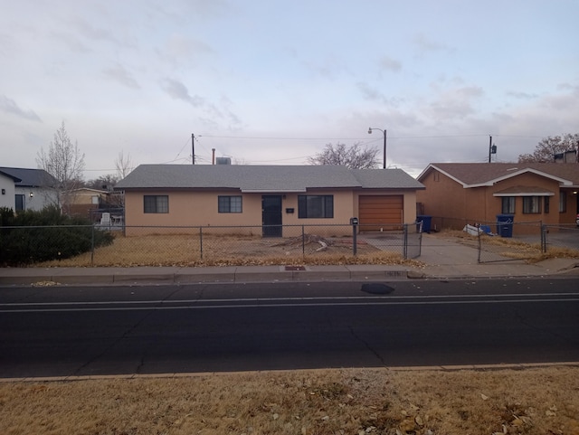 ranch-style house featuring a garage