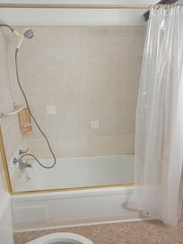 bathroom with shower / bath combination with curtain