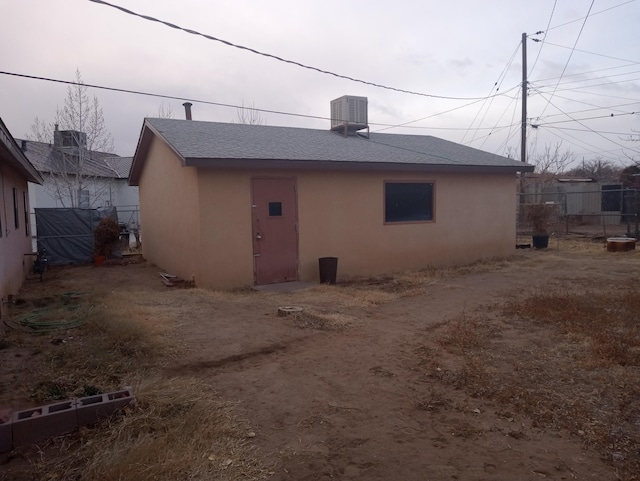 rear view of property featuring central air condition unit