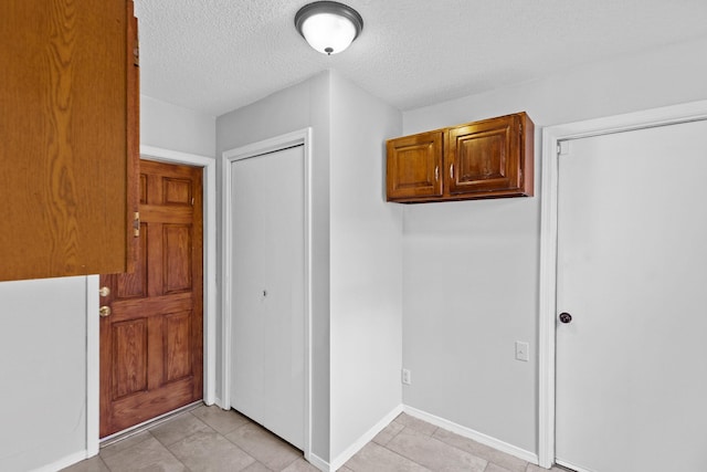 interior space featuring a textured ceiling