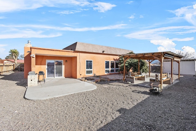 back of property featuring outdoor lounge area, a pergola, and a patio