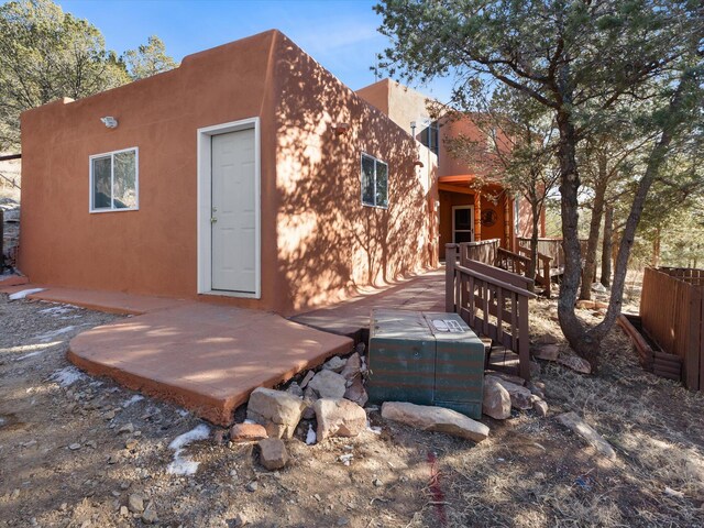 rear view of property with a deck