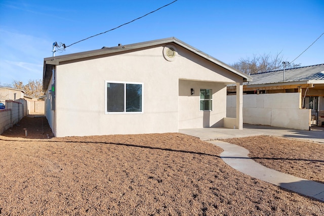 back of house featuring a patio