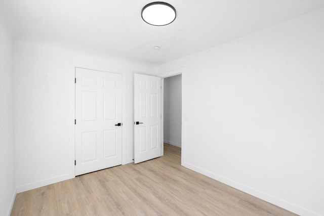 unfurnished bedroom with light hardwood / wood-style floors