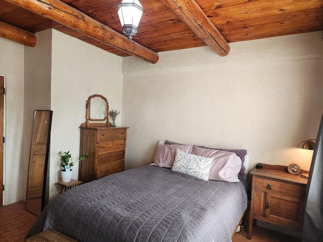 bedroom with beamed ceiling and wooden ceiling