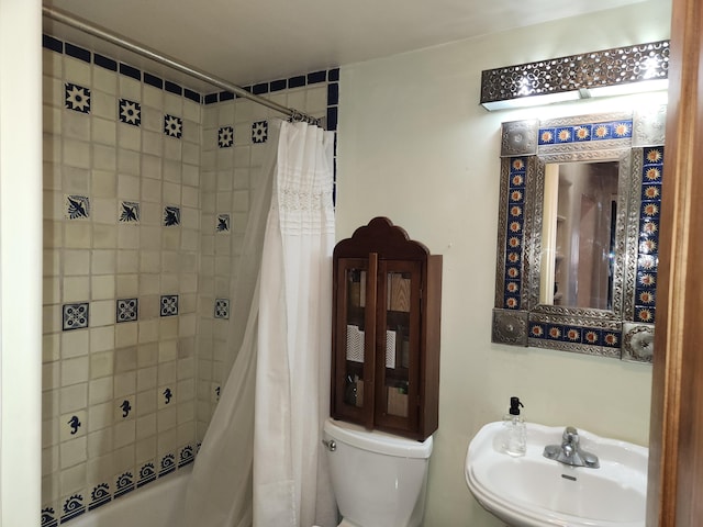 full bathroom with sink, toilet, and shower / bathtub combination with curtain