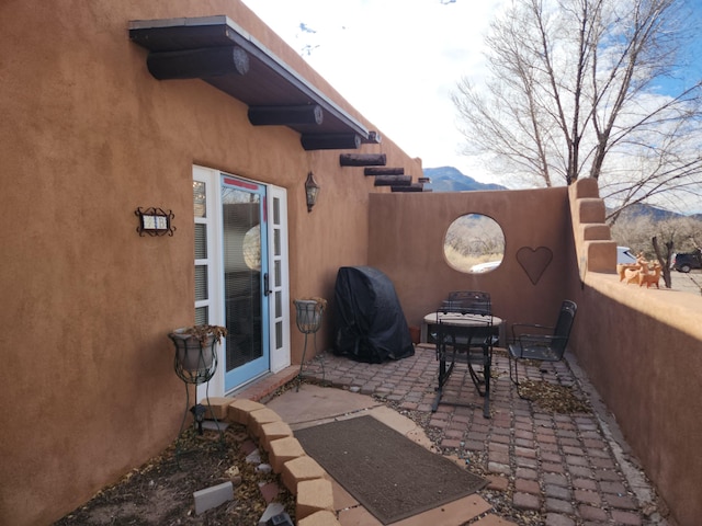 view of patio featuring a mountain view and grilling area