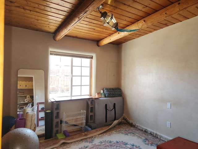 misc room with wooden ceiling, electric panel, and beamed ceiling