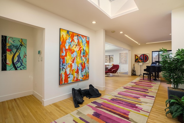 corridor featuring light hardwood / wood-style floors