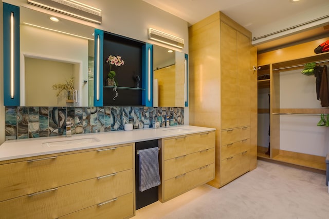 bathroom with decorative backsplash and vanity