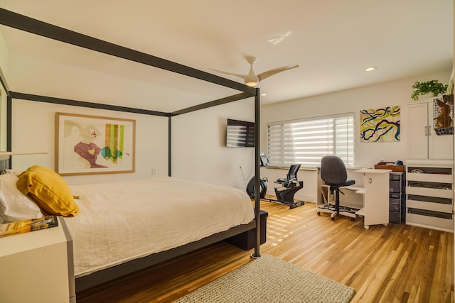 bedroom featuring ceiling fan and light hardwood / wood-style flooring