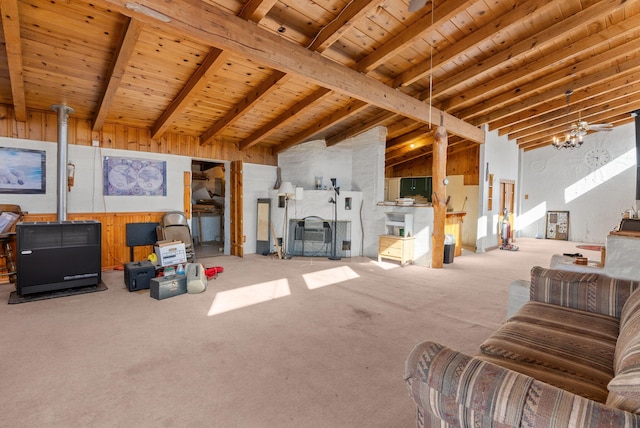 living room with wood ceiling, high vaulted ceiling, carpet flooring, beamed ceiling, and wood walls