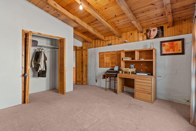 carpeted home office featuring vaulted ceiling with beams and wooden ceiling