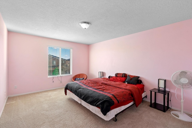 carpeted bedroom featuring a textured ceiling