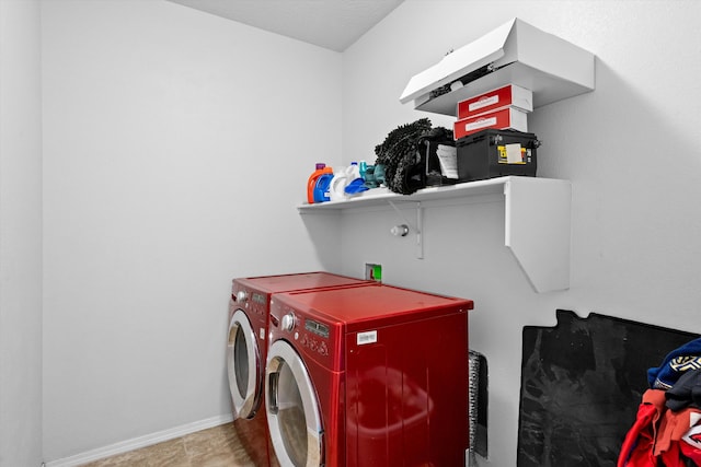 clothes washing area with separate washer and dryer