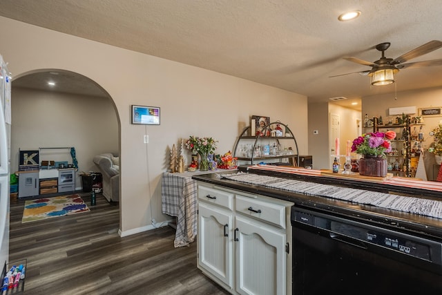 kitchen with a textured ceiling, white cabinetry, dishwasher, ceiling fan, and dark hardwood / wood-style flooring