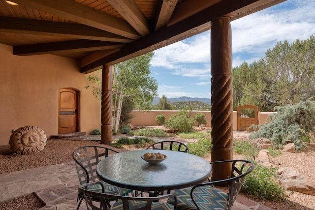 view of patio / terrace featuring a mountain view