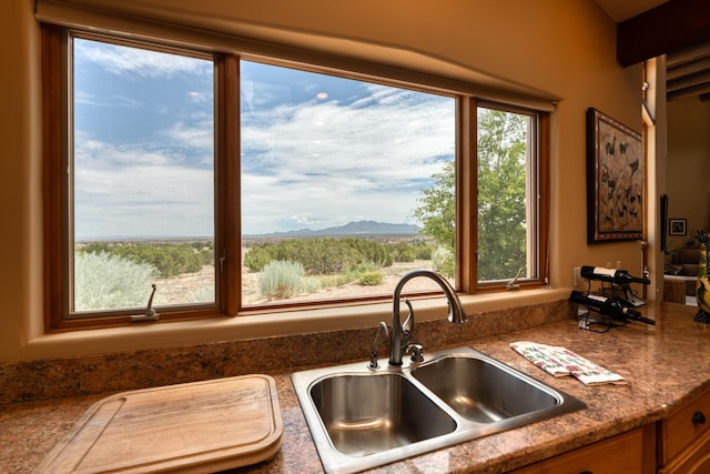 kitchen with a mountain view and sink