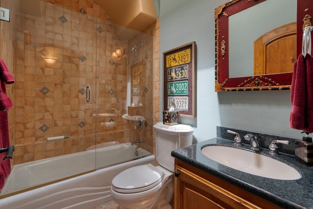 full bathroom with toilet, vanity, and combined bath / shower with glass door