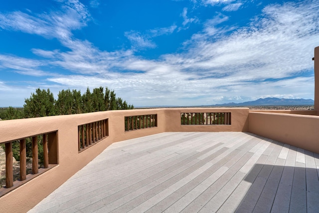 wooden terrace featuring a mountain view