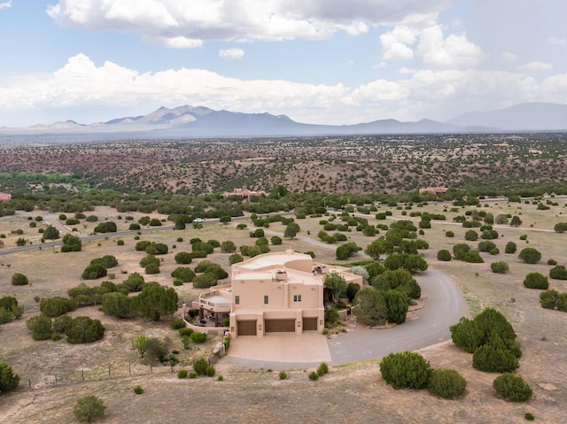 birds eye view of property featuring a mountain view